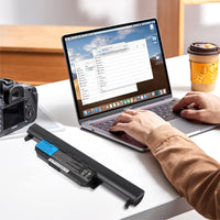 What should I do if my laptop battery makes noise when charging?